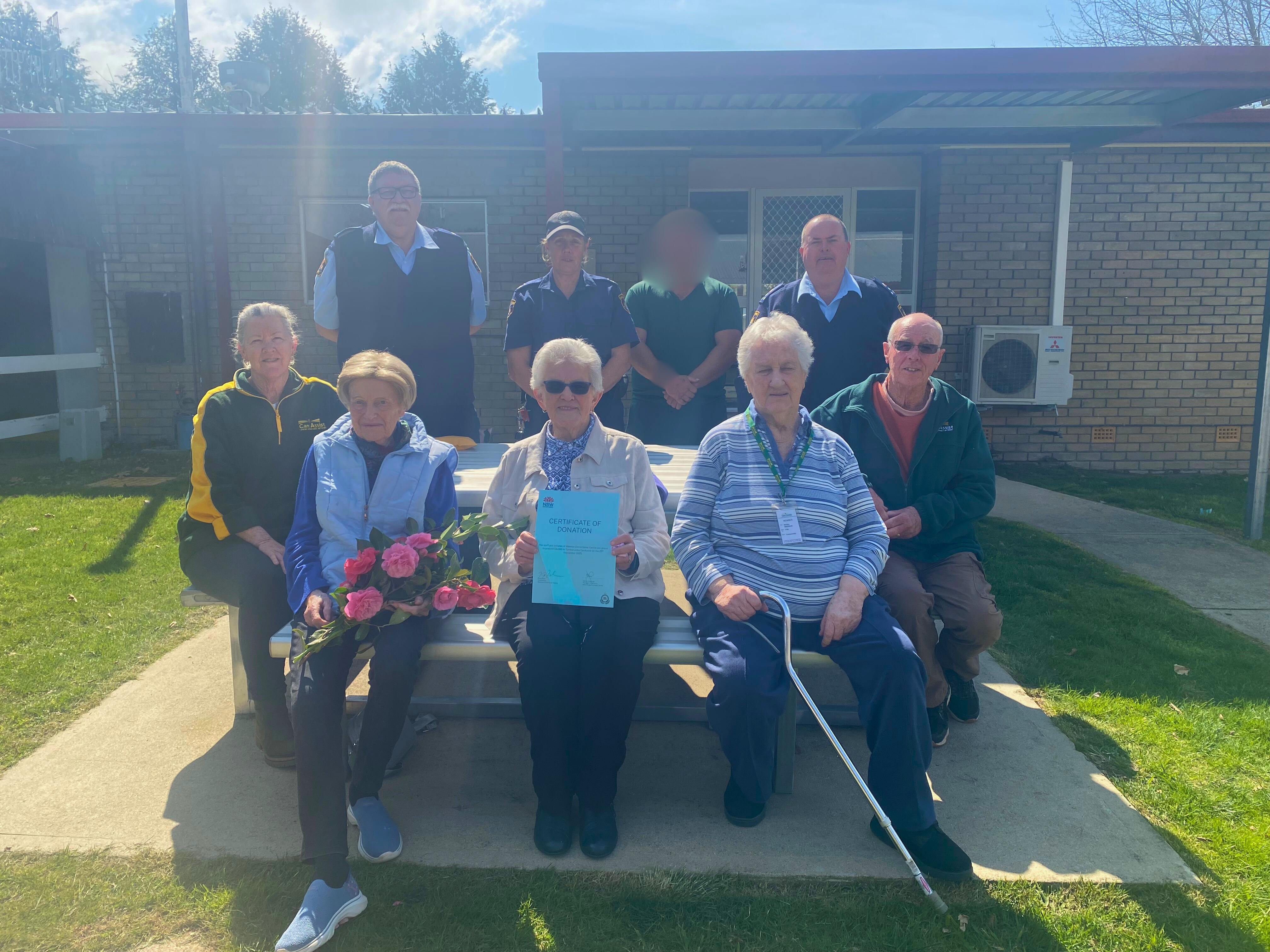 Group of people sitting in the sun