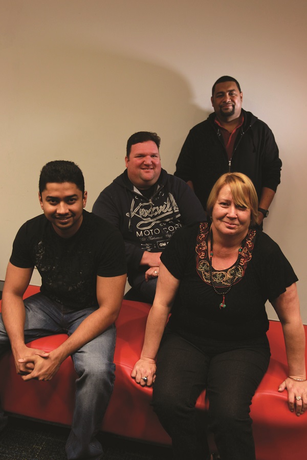 All four case workers smiling for a picture