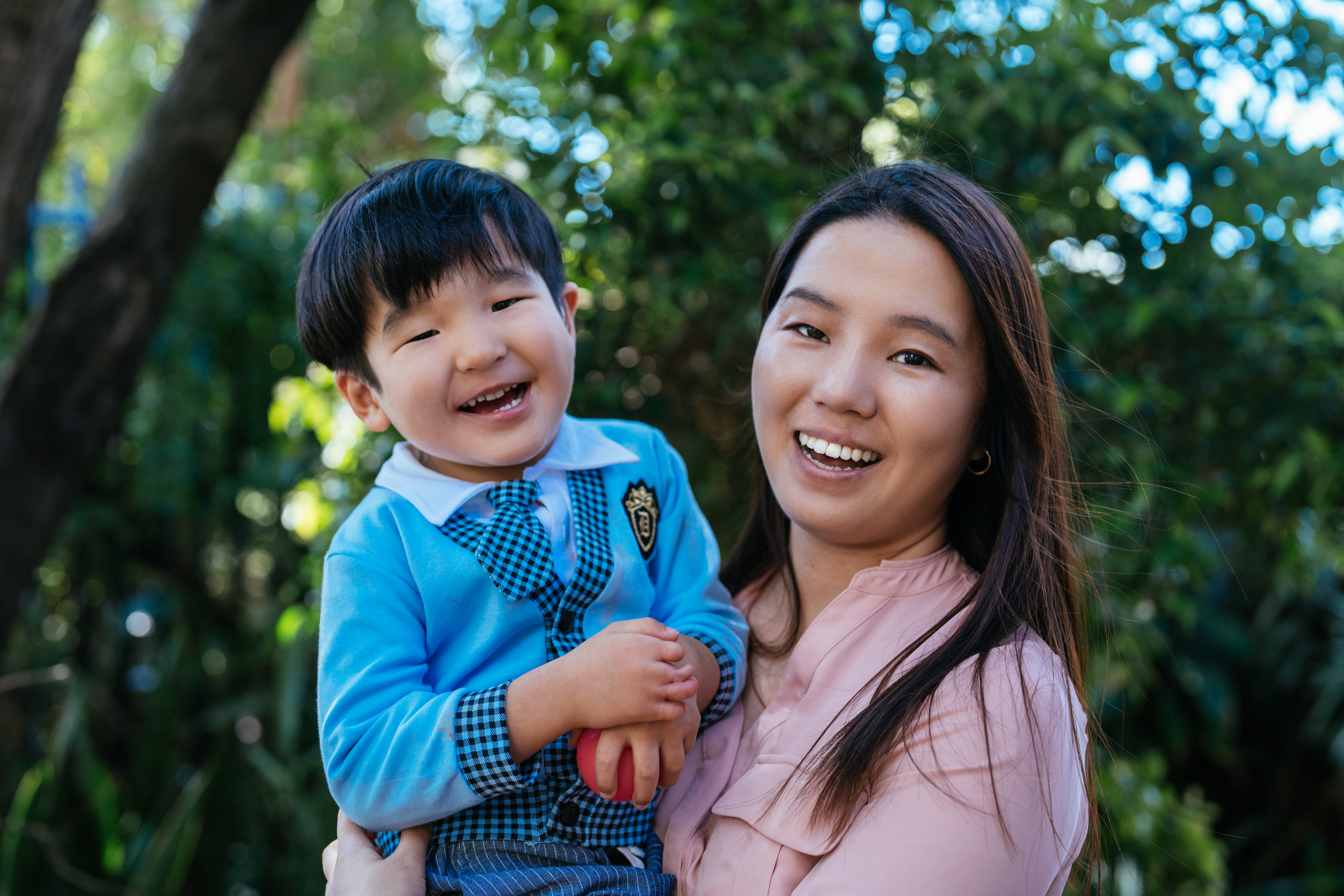 Mother holding a young boy in her arms