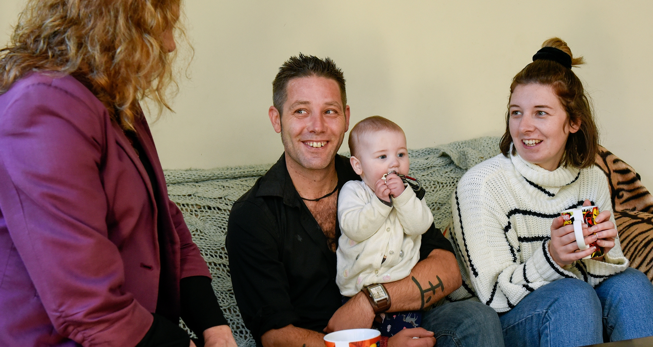 Family sitting on couch